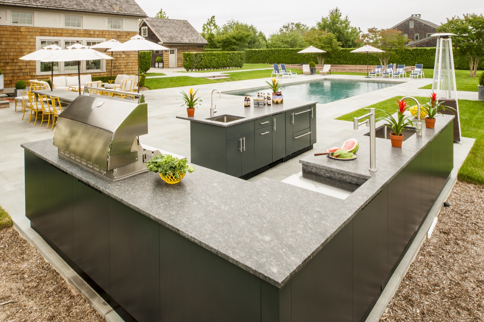 Danver U-shaped stainless outdoor kitchen beside a pool